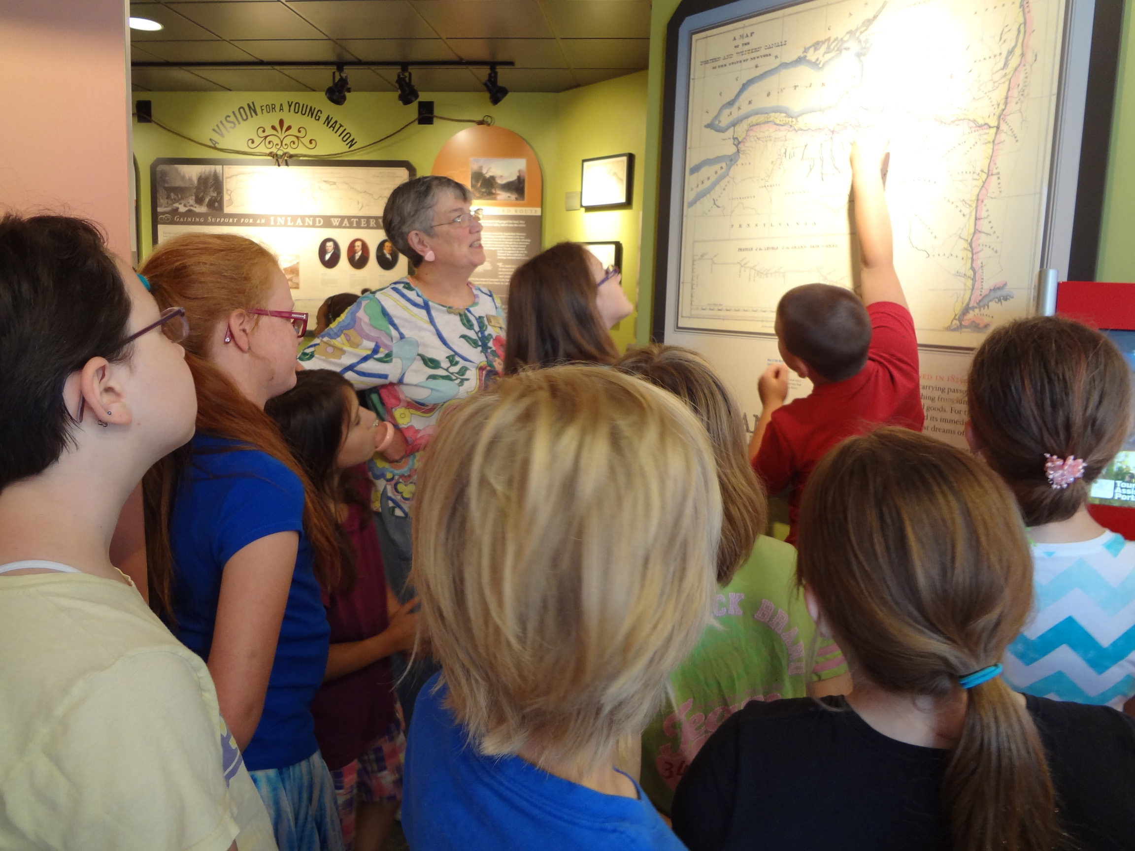 Erie Canal Museum docent Ann Reed leads a school tour. 